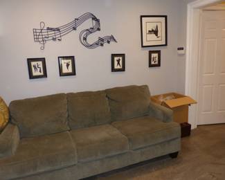 Sofa, Bookcase, Musical Wall Hangings