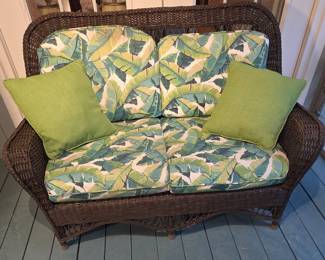 Wicker Loveseat with Tropical Leaf Cushions