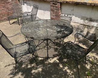 Mesh wrought iron patio table and 4 chairs 