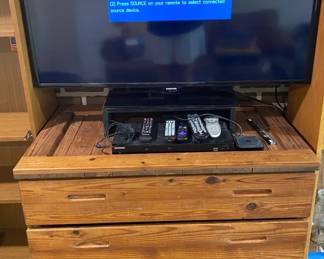 Samsung Smart tv With DVD player And Assorted Remotes And Standcabinet