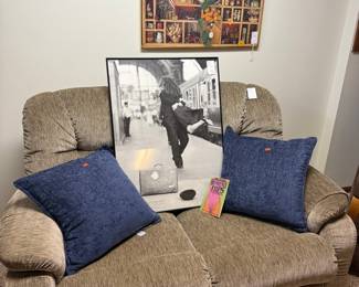 Reclining Sofa with Decorative Pillows and Framed Print