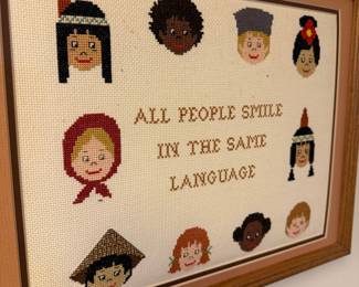 Cross-Stitched "All People Smile In The Same Language" Framed Art