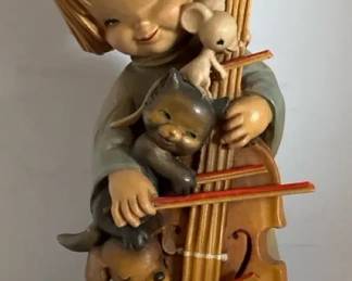 ANRI Girl Playing Cello With Animals