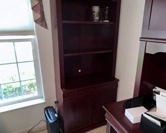Dark cherry finish bookcase with cabinet