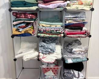 Lots of fabric - both new, vintage, and bedsheets that can be used for large sewing projects