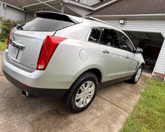 Cadillac SRX rear, silver crossover SUV