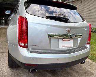 Cadillac SRX rear view, silver crossover SUV