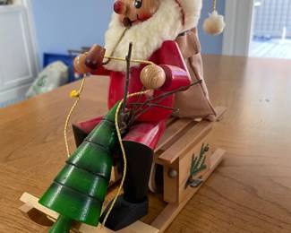 Smoking, moving Santa on a sleigh that travels music box