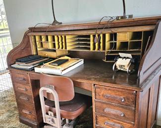 Executive size roll top desk with vintage chair