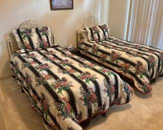 Twin beds with decorative matching curly gold headboards(sold se they reversible bedspreads and shams