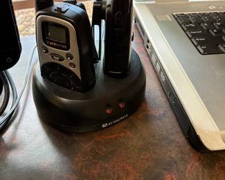 Audio Vox two-way radio set includes two handheld radios, and a dual charging dock