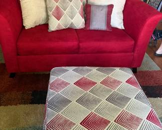 Red love seat, pillows, ottoman