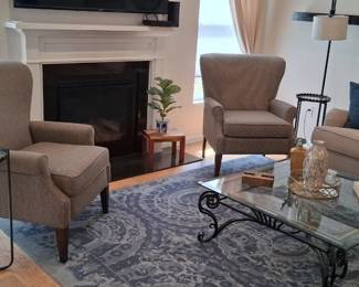 Wingback chair and glass top coffee table