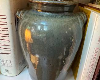Pottery nestled among the cookbooks 