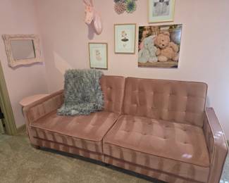 Pink tufted sofa
