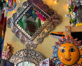 Talavera pottery sun, tin mirror and other folk art.