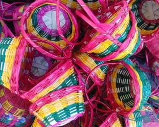Small, hand woven palm baskets.