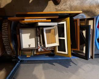 There are four containers of picture frames