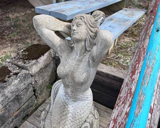 Cement mermaid garden statue
