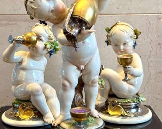 $1200 - set of 3 Capodimonte Giuseppe Cappe figurines "Putti with Wine" - figurine in forefront is 12 inches tall, figurines in back are 8.5 inches tall. 