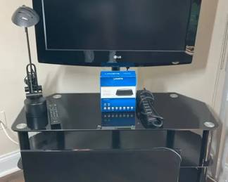 32 LG And 32 ONN Roku TVs With TV Stand And Office Light