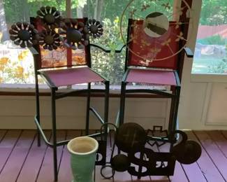 Pair of Outdoor Bar Height Chairs with Metal Wall Decor and Garden Accents