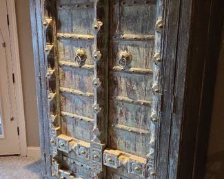 Carved Distressed wood w/metal studs media cabinet