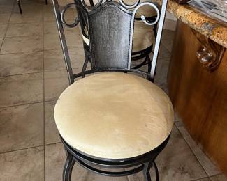 Four wrought iron swivel bar stools