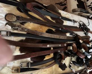 Large group of leather and reptile belts to be sold