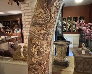Note the finely detailed tusk carving