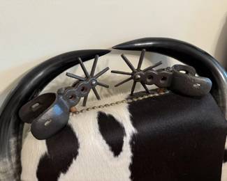 Detail of spurs on backs of chairs