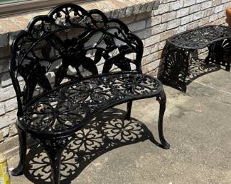 Cast metal painted outdoor loveseat and occasional table