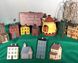Wooden village and plaque 