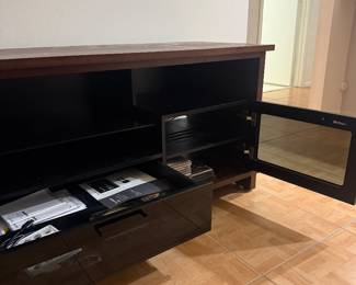 BDI High-End TV Console / Entertainment Center – Like New...   Premium BDI high-performance media console in excellent, like-new condition.  Dimensions: 68.5” W × 20.5” D × 27” H  Finished in brown with cabinets and drawers designed for full entertainment systems.  Features: • Built-in cable management • Ventilated storage for electronics • Adjustable shelving • High-quality, modern design  BDI is known for top-tier construction and functionality—this is not a basic TV stand.  No scratches or damage. Very well maintained.  