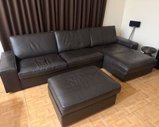 IKEA Kivik sectional couch in like-new condition.   Includes: • L-shaped chaise lounge • Storage ottoman • Black fabric leather like   125 in L x 35 in D x 3 feet H couch  The chaise lounge is 65 in L