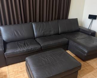 IKEA Kivik sectional couch in like-new condition.   Includes: • L-shaped chaise lounge • Storage ottoman • Black fabric leather like   125 in L x 35 in D x 3 feet H couch  The chaise lounge is 65 in L