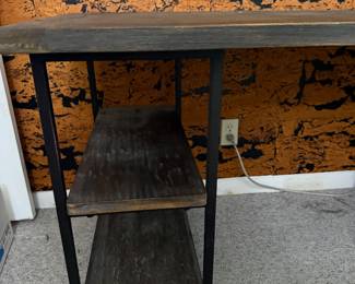 Modern industrial-style desk or console table in great condition.  Dimensions: 48” L × 28” D × 35” H  Features: • Wood top with black metal frame • Built-in shelving on both sides for storage • Sturdy and versatile design  Perfect as a desk, entry table, or bar/serving console.  clean and well maintained.