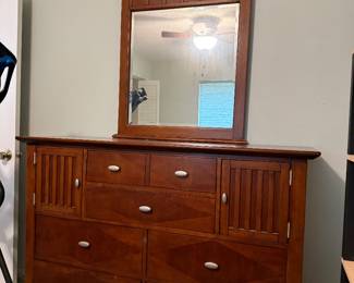 Kathy Ireland Home light cherry brown wood queen bedroom set for sale.  Must go this Thursday/Friday. Make your best offer.   Set includes queen bed with headboard, footboard, rails, foundation, dresser, mirror and one nightstand.    Dresser 5 ft L x 19in D x 42 un H Nightstand  30 in L x 18 in D x 27 in H  If you need a mattress we have an almost new Nectar mattress also for sale.    Beautiful Kathy Ireland Home queen bedroom set in excellent, like-new condition.  Includes: • Queen bed (headboard, footboard, rails) • Dresser with mirror • 1 nightstand • Box spring  No major scratches or damage. From a clean, smoke-free home.
