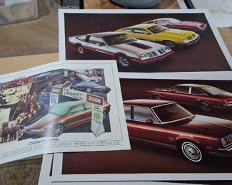 vintage advertising prints feature various Oldsmobile models, including the Starfire and Firenza from the late 1970s