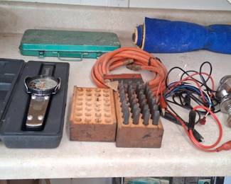 automotive tools, including a timing light, tach/dwell meter, and compression tester