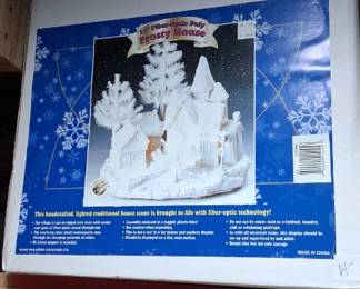 Pan Asian Creations 11-inch fiber-optic Frosty House is a traditional Christmas village scene