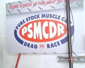 Pure Stock Muscle Car Drag Race sign (PSMCDR), a drag racing event held in Michigan