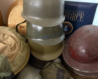 . . . vintage military Doughboy and other helmets