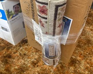 . . . brand new throw rug -- there are several of these -- brand new!