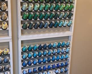 Embroidery Thread Spools on Wooden Racks
