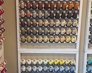 Embroidery Thread Spools on Wooden Racks