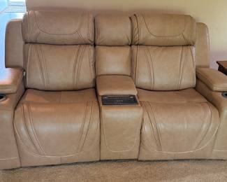 Excellent Leather Loveseat with all the push button bells and whistles.