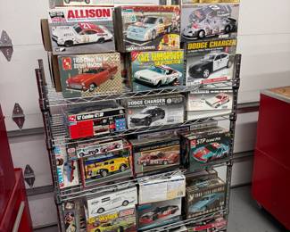Several racks of model car kits