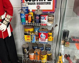 Vintage oil rack with vintage oil related items