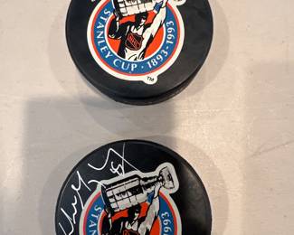 Autographed hockey pucks